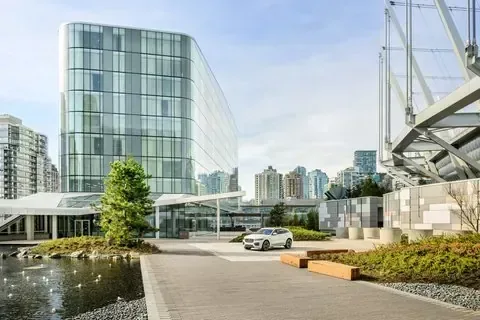 JW Marriott Parq Vancouver, Vancouver — the glass towers above the riverfront promenade
